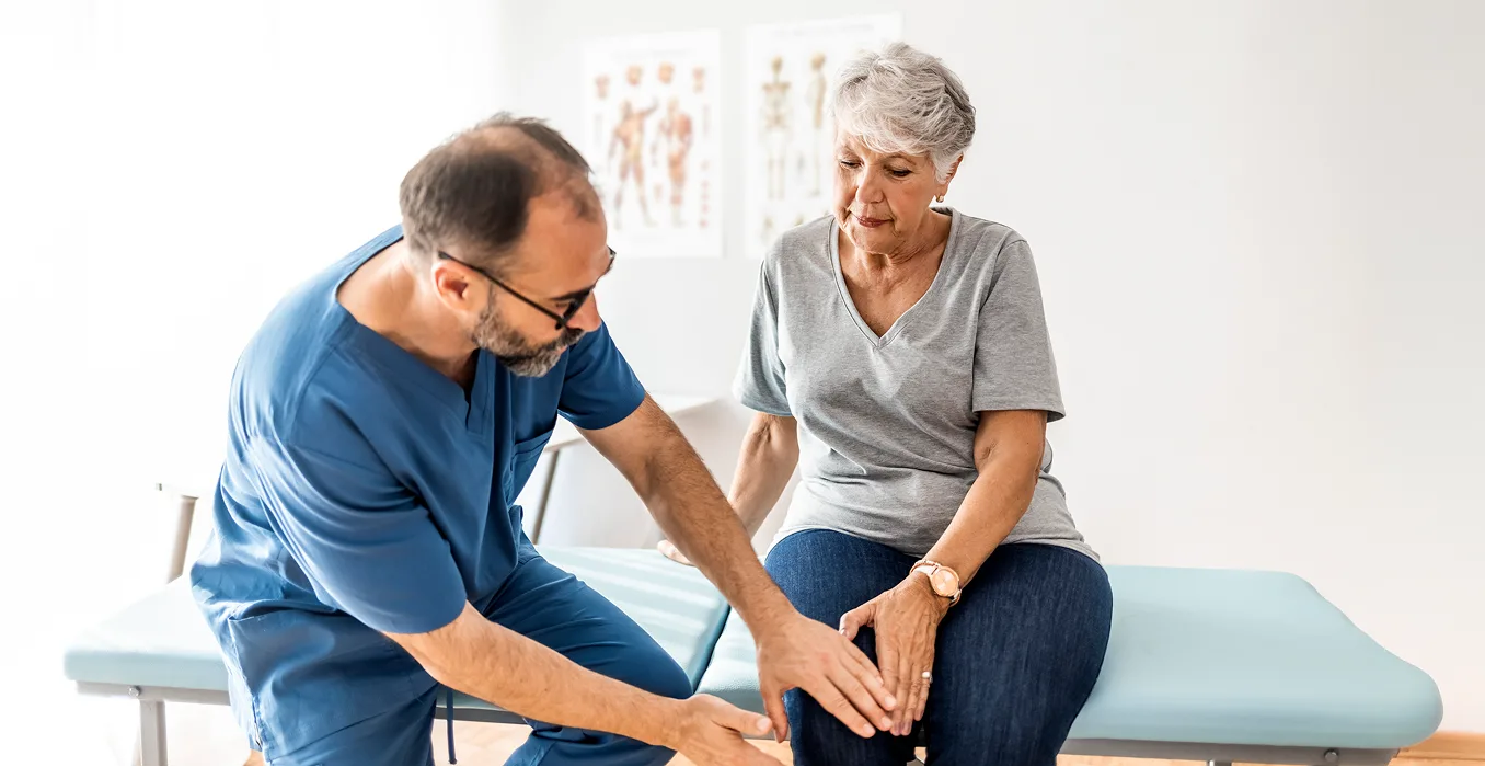 young black African American couple smiling, showing their bandages after getting vaccinated